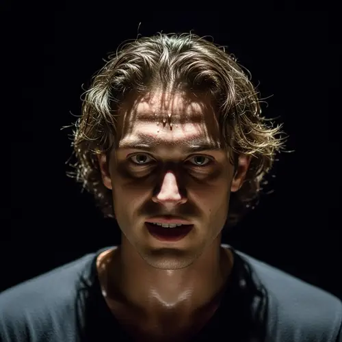 Male Actor Performing Under Dramatic Lighting