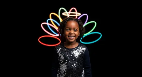 Smiling Little Girl with Colorful Halos in the Dark