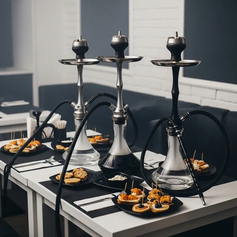Elegant White Table with Black Hookahs and Delightful Snacks