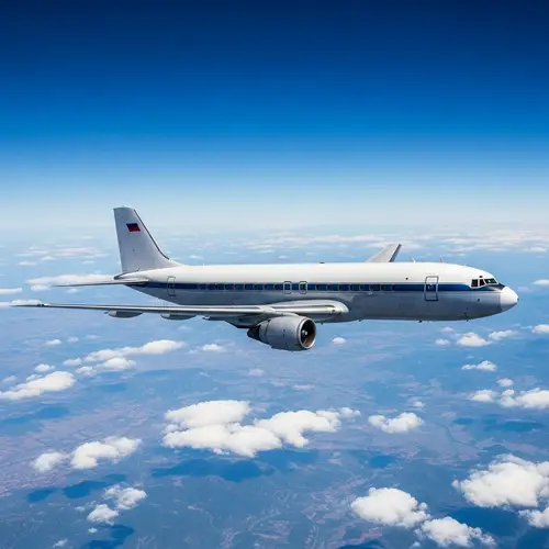 Classic Passenger Airplane Flying in Clear Blue Sky