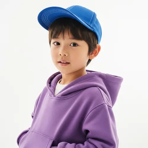 Young Chinese Boy in Blue Cap and Purple Hoodie