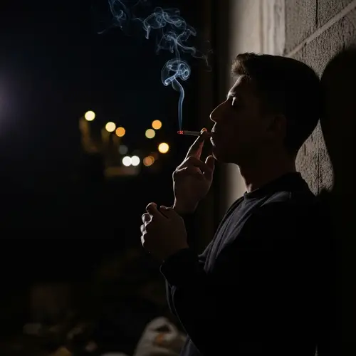 Heartbroken Hispanic Male Silhouette in Dimly Lit Alley