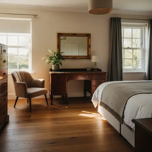 Cozy Bedroom with Antique Desk and Velvet Chair