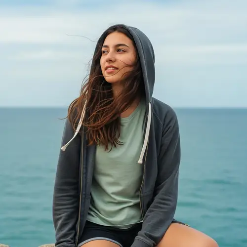 Engaging Hispanic Girl in Unzipped Hoodie and Shorts