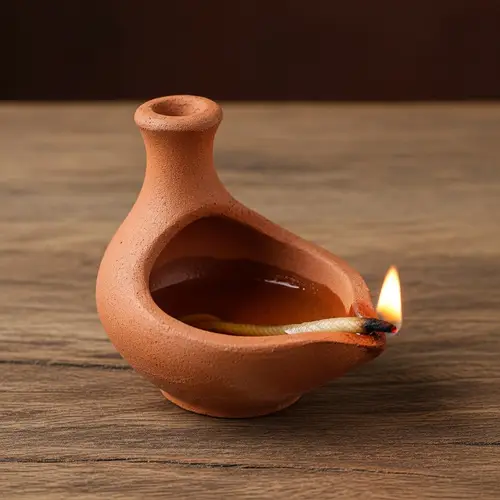 Handcrafted South Asian Earthen Lamp on Rustic Wooden Table
