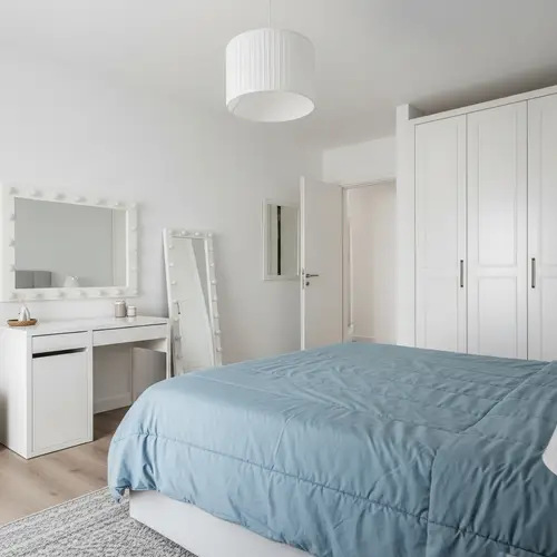 Serene Bedroom with Queen Size Bed and Calming Blue Comforter