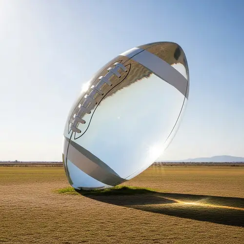 Gigantic Transparent Glass Football Balancing Act