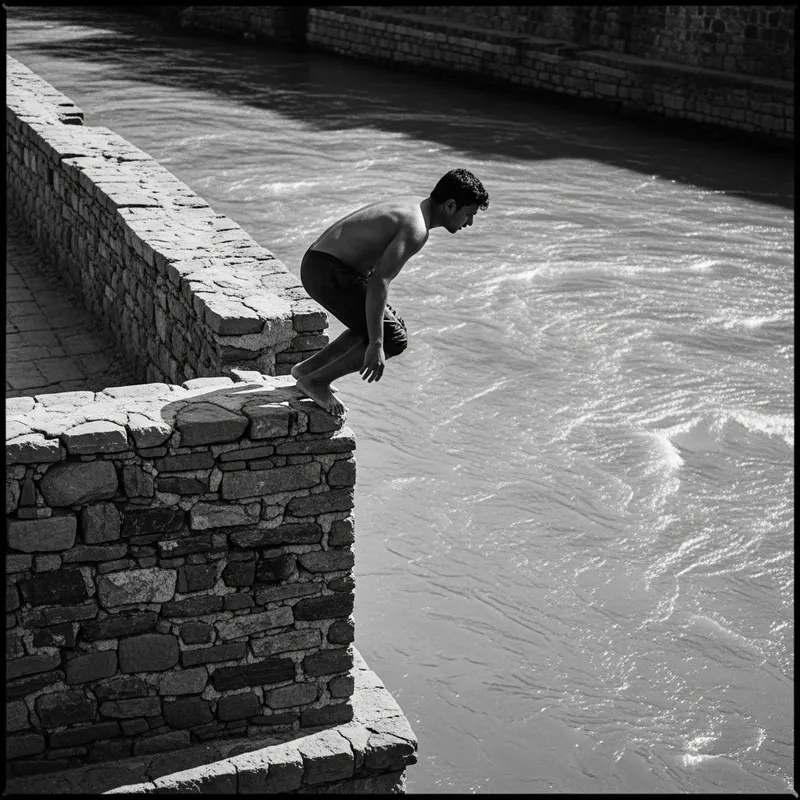 Dramatic Man Suspensefully Perched on Wall Over River | Canon EOS R6 50mm Lens Dramatic Man Suspensefully Perched on Wall Over River | Canon EOS R6 50mm Lens