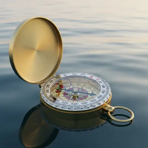 Ornate Brass Compass Floating on Tranquil Sea