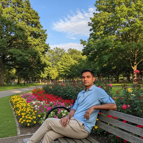 South Asian Man Relaxing in Vibrant Park Setting