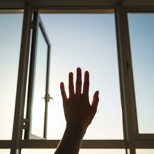 Minimalist 4K Image: Hand & Open Window