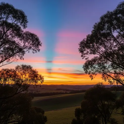 Serene Sunset Landscape with Colorful Sky Streaks