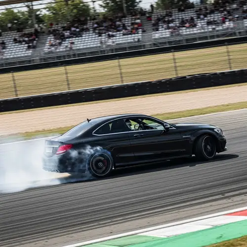 Black Mercedes-Benz C63 AMG Drifting Action Shot