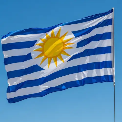 Flag Fluttering in the Wind against Blue Sky