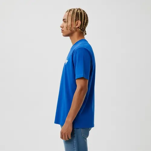 Stylish African American Man in Blue T-shirt and Jeans