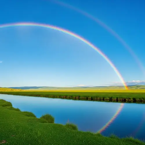 Vibrant Rainbow Over Green Field and Crystal River