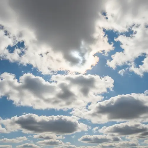 Radiant Sky with Fluffy Clouds: Ethereal Beauty Captured