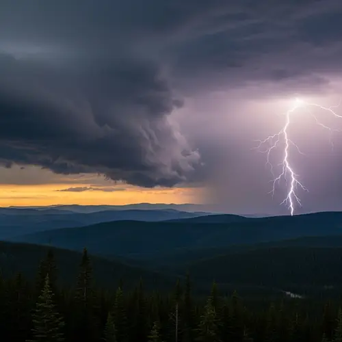 Intense Landscape Scene: Thunderstorm Brewing Over Forest Mountain Range