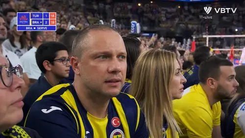 Candid Volleyball Fan Moments in Packed Arena