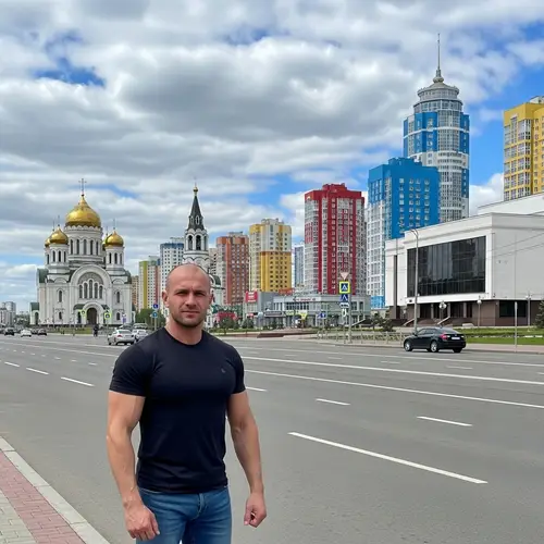 Muscular Man Standing in Saransk, Russia | Landmarks & Cityscape View
