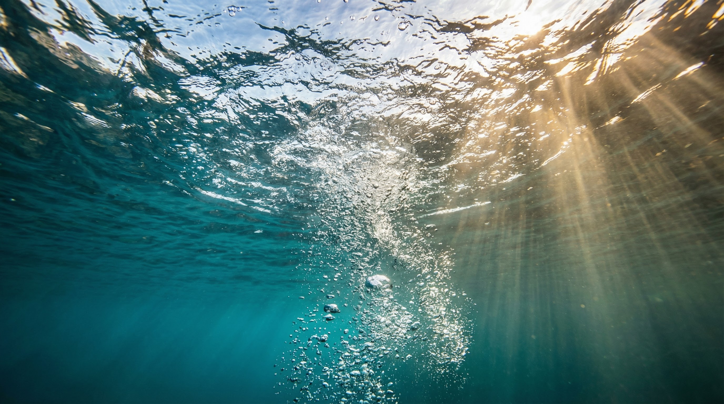 AI-generated underwater shot with bubbles rising through turquoise water