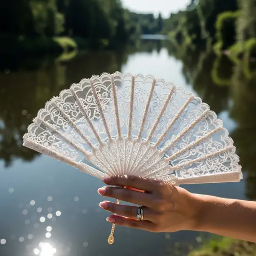 Elegant Lace Fan Held by a Woman by the River | Exquisite Jewelry