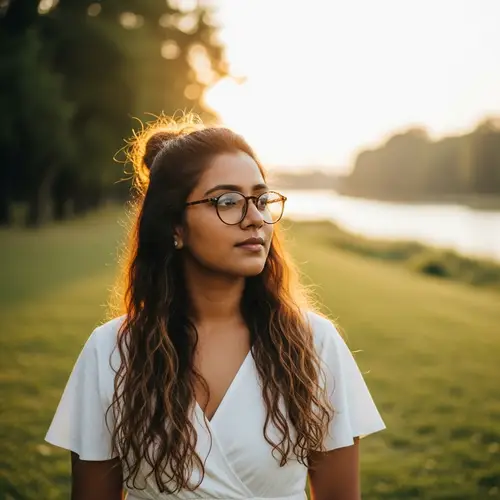 Stylish South Asian Woman in Round Glasses and Summer Dress