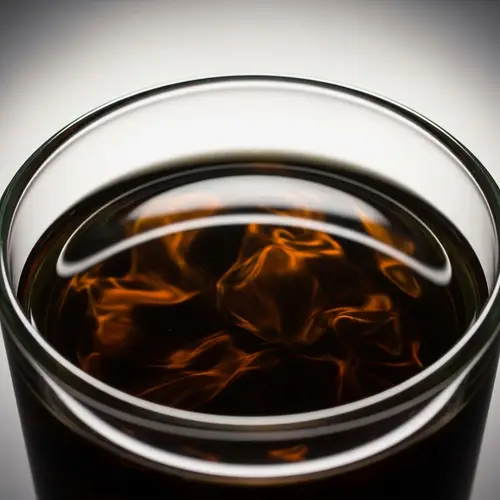 Motor Oil in Clear Glass Container - Brown and Black Liquid