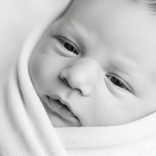 Adorable Newborn Baby Wrapped in Soft Fabric Blanket