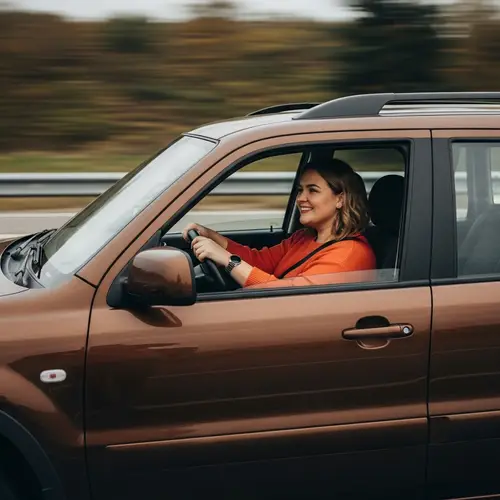 Detailed Image of Brown Vehicle in Motion Driven by Woman