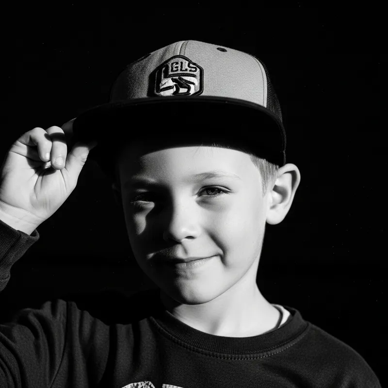 Dramatic Fine Art Portrait of a Playful Boy in Black and White