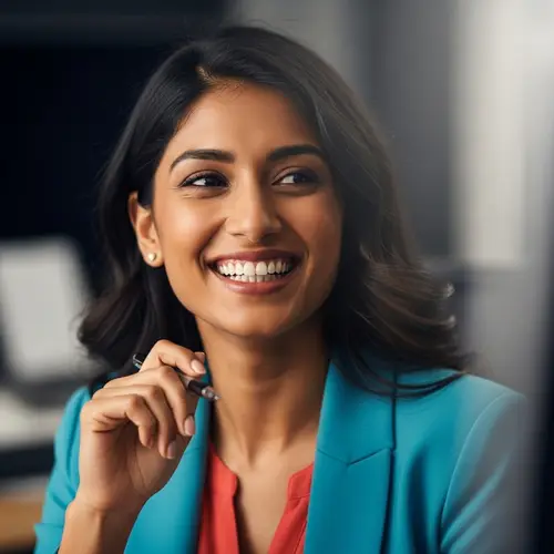 Joyful South Asian Female Marketing Manager in Office Setting