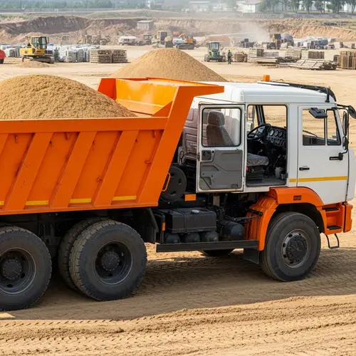 Robust Orange Dump Truck Loaded with Golden Sand