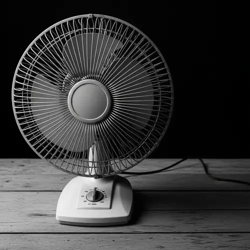 Vintage Electric Fan on Rustic Table: Nostalgic Photo