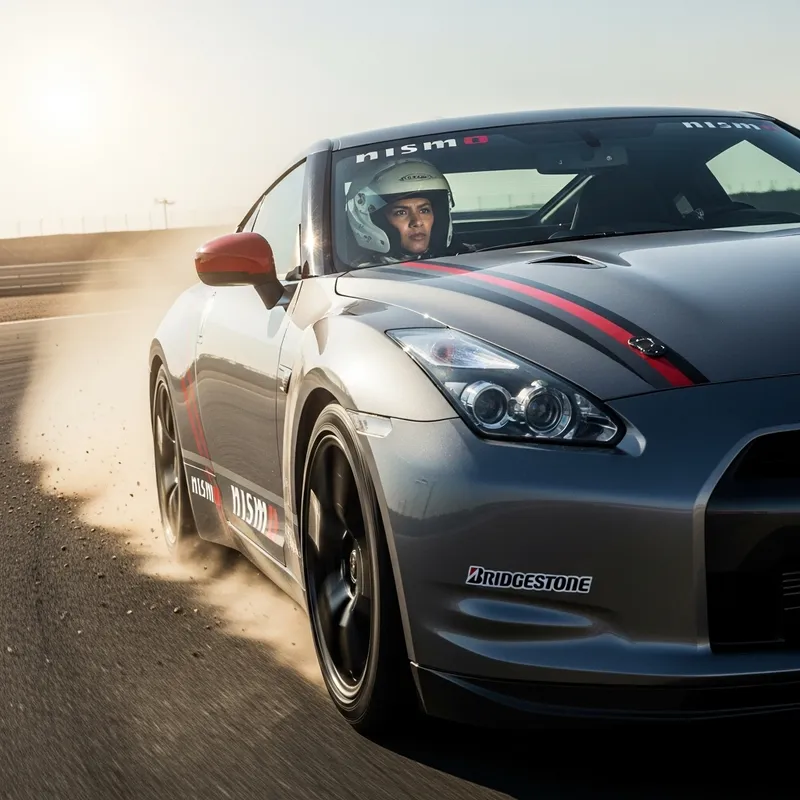 Sleek Steel-Grey Nissan Racing Car with Racer Driver