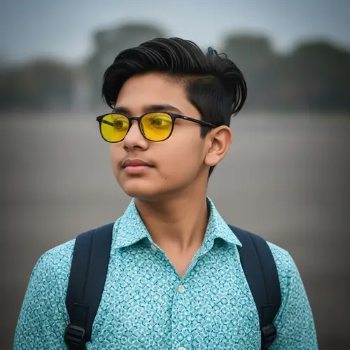South Asian Boy with Glasses and Yellow Eyes