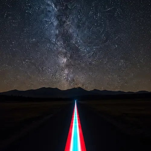 Night Sky Wilderness Landscape with Twinkling Stars and Silhouettes of Mountains