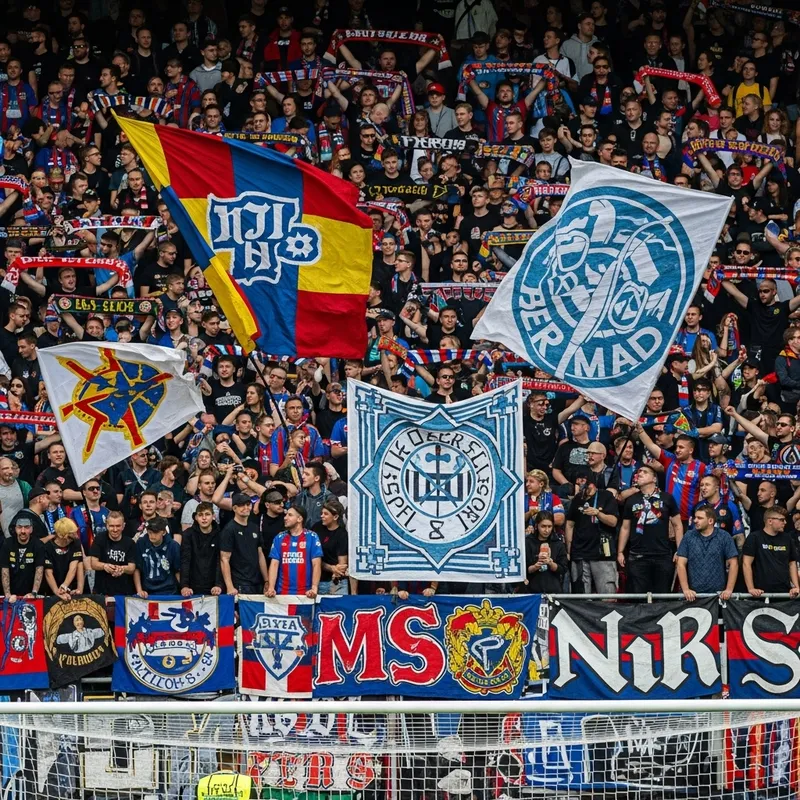 Passionate Soccer Fans and Vibrant Ultras at Packed Stadium