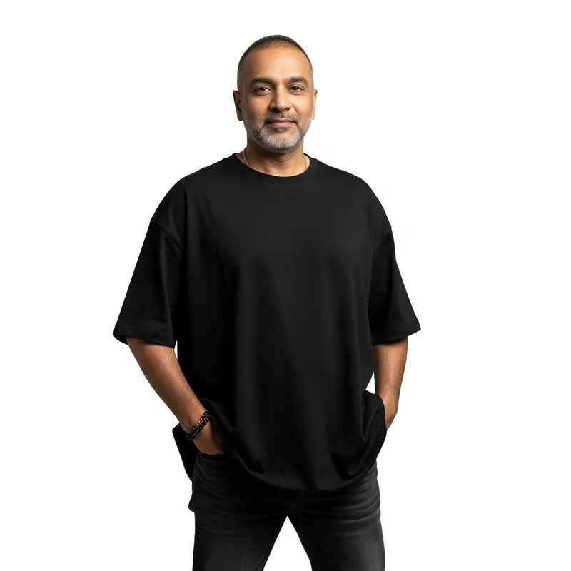 Confident South Asian Man in Oversized Black T-Shirt