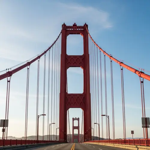Iconic Red Bridge Against Azure Sky