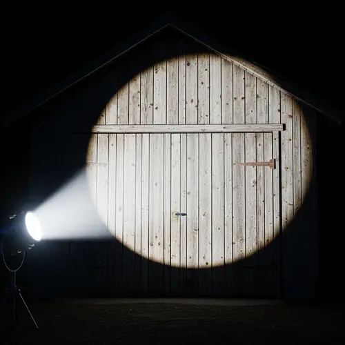 Antique Wooden Garage Illuminated by Bright Searchlight