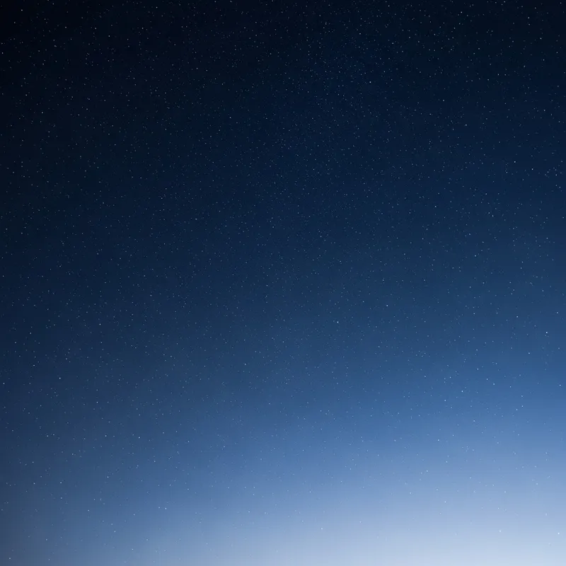 Serenity in Blue: Tranquil Night Sky with Sparkling Stars