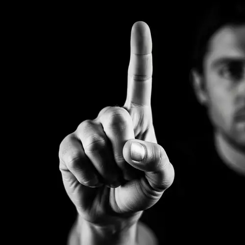 High Contrast Black and White Photography of Hand Gesture