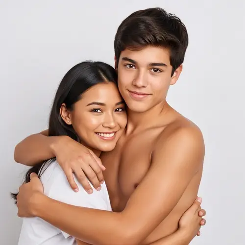 Interracial Couple Embrace: Shirtless Hispanic Boy & South Asian Girlfriend