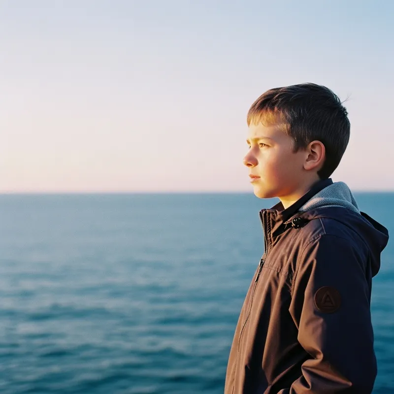 Serenity and Wonder: Young Boy in Vibrant Seascape Serenity
