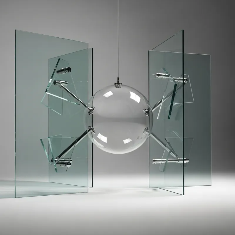 Artful Glass Sphere Installation with Abstract Geometric Influence
