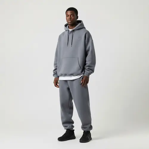 Diverse Male Model in Oversized Sports Suit with Hood