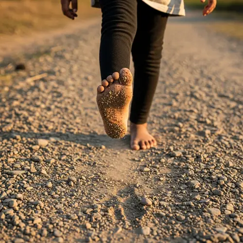 Enthusiastic South Asian Girl Walking Barefoot on Gravel