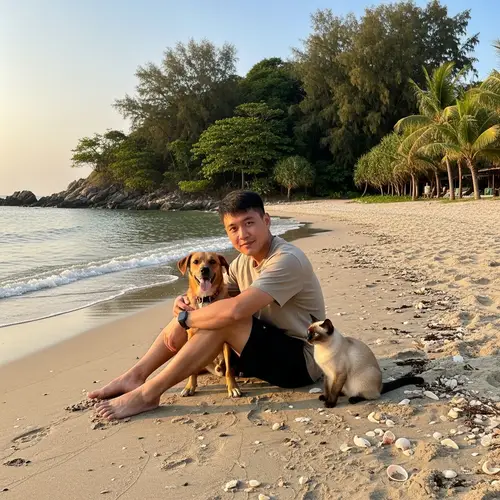 Tranquil Beach Scene with Asian Man, Dog, and Cat at Sunset