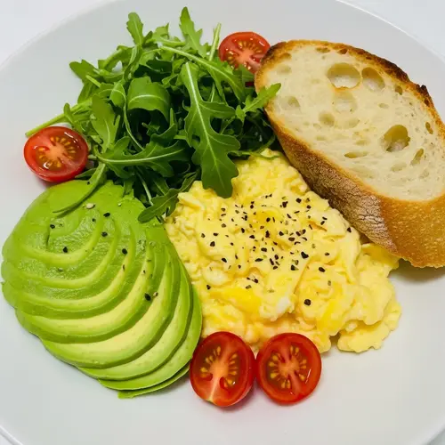 Tender Scrambled Eggs with Avocado and Rocket Salad